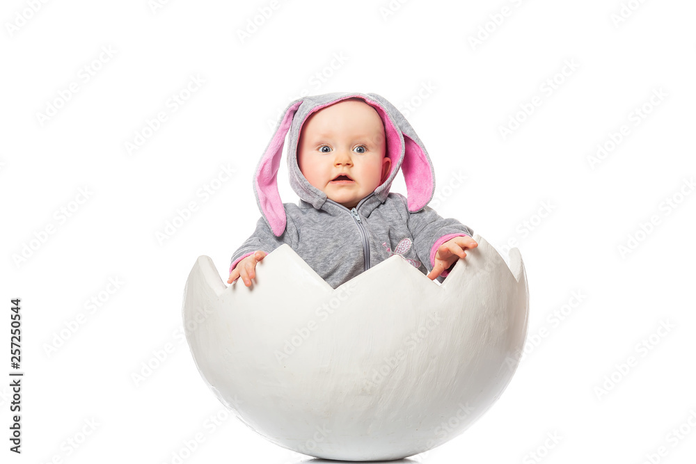 Cute little baby with bunny costume in Easter egg. on white background. Kinder  Surprise Stock Photo | Adobe Stock