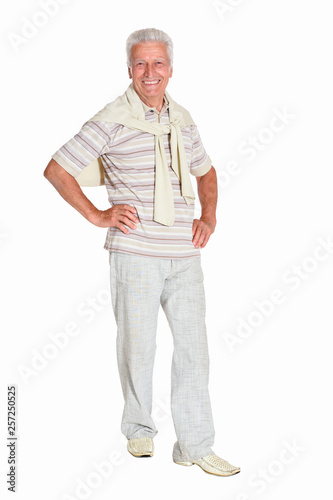 Portrait of senior man posing on white background, full length