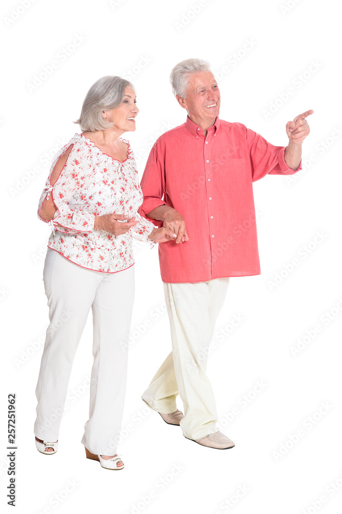 Full length portrait of senior couple holding hands isolated Full length portrait of senior couple holding hands isolated