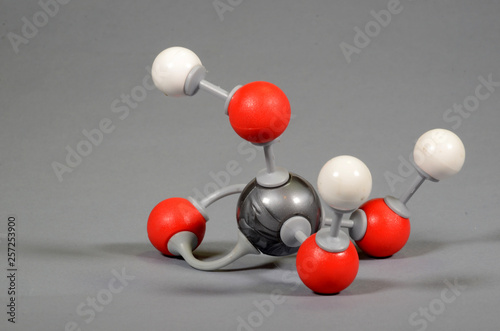 Molecule model of phosporous acid. White is hydrogen, gray is phosphor, red is oxygen. photo