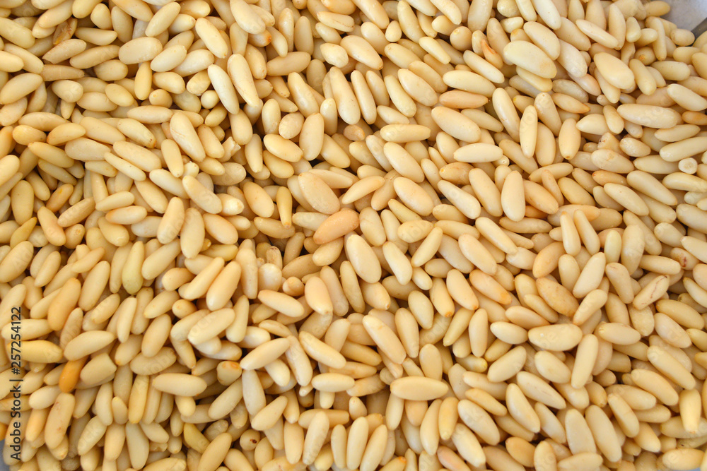 Texture of shelled pine nuts in flat lay angle. Texture of shelled pine nuts in flat lay angle.