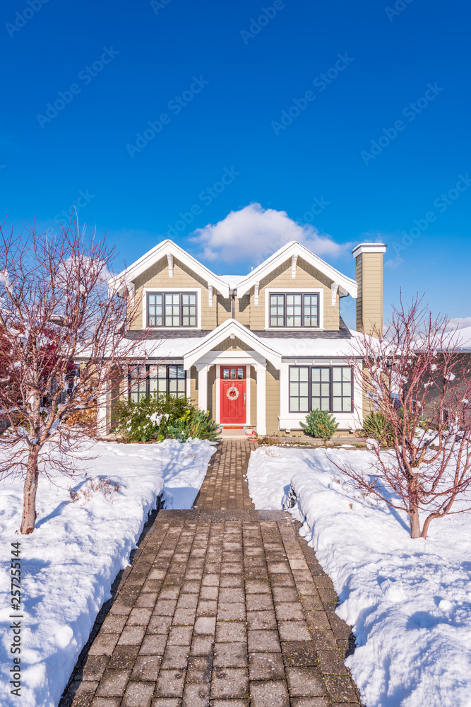 A typical american house in winter. Snow covered. A typical american house in winter. Snow covered.