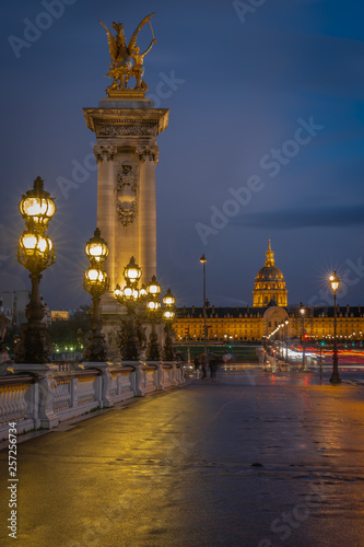 Paris, France - 03 17 2019: Quays of the Seine. Alexander III Bridge by sunset