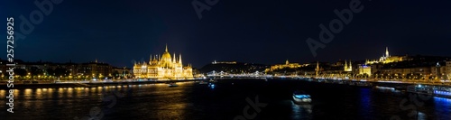 Panoramic night view of the Danube River as it passes through Budapest along with the Parliament, the Cathedral, the Fishermen's Bastion, the Buda Castle-Palace, the Chain Bridge and the Fortress,