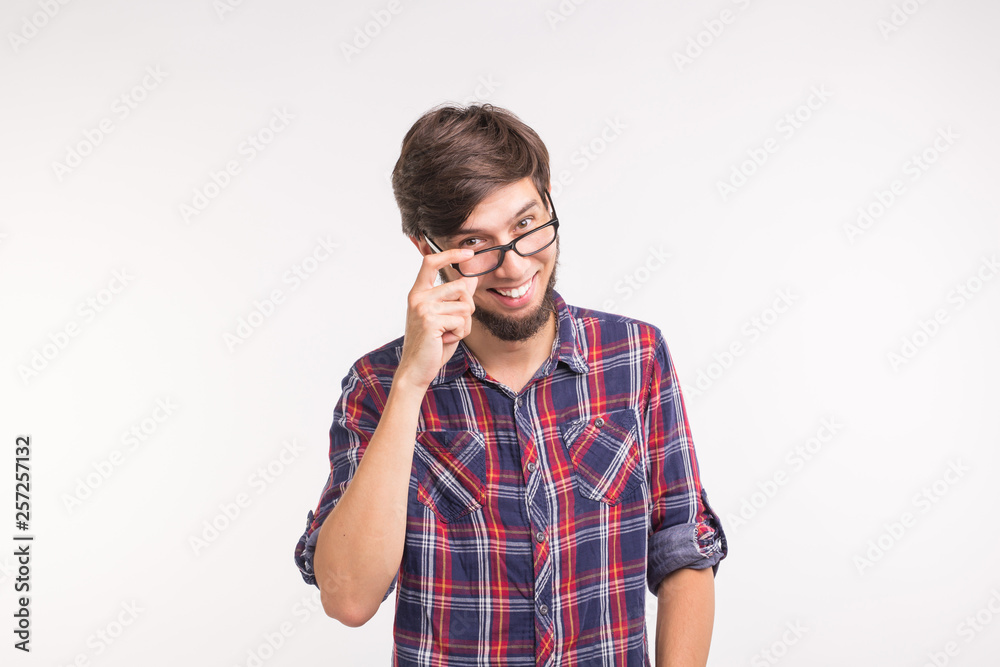 Expression and gesture concept - Surprised man looking at the camera on white background Expression and gesture concept - Surprised man looking at the camera on white background