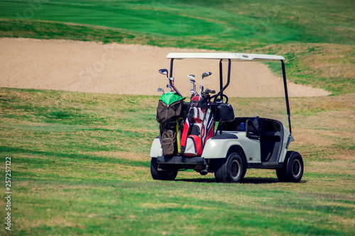 Golf carts on the grass sport field. Lifestyle and sport concept