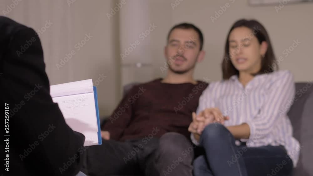 defocused couple at the therapy session with psycologist.Crisis,marriage,problem defocused couple at the therapy session with psycologist.Crisis,marriage,problem