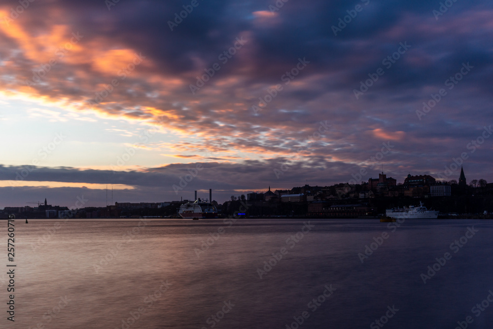 A red, colorful sunrise on the sea in the harbor of Stockholm in winter with the backdrop of the Old Town - 5 A red, colorful sunrise on the sea in the harbor of Stockholm in winter with the backdrop of the Old Town - 5