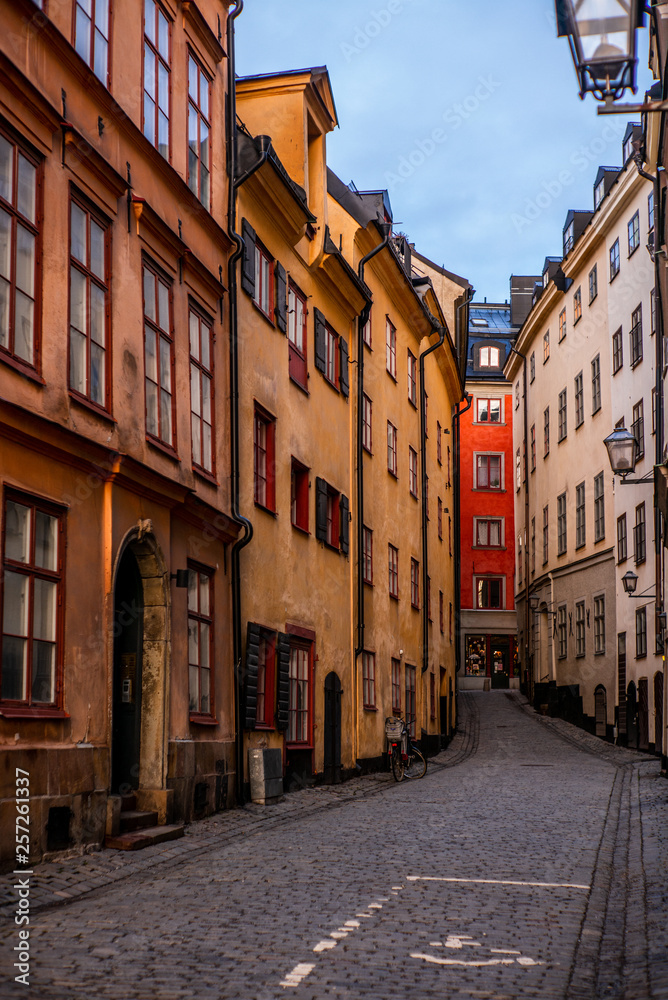 Old cobbled narrow street with coilorful houses in Stockholm in the morning - 1