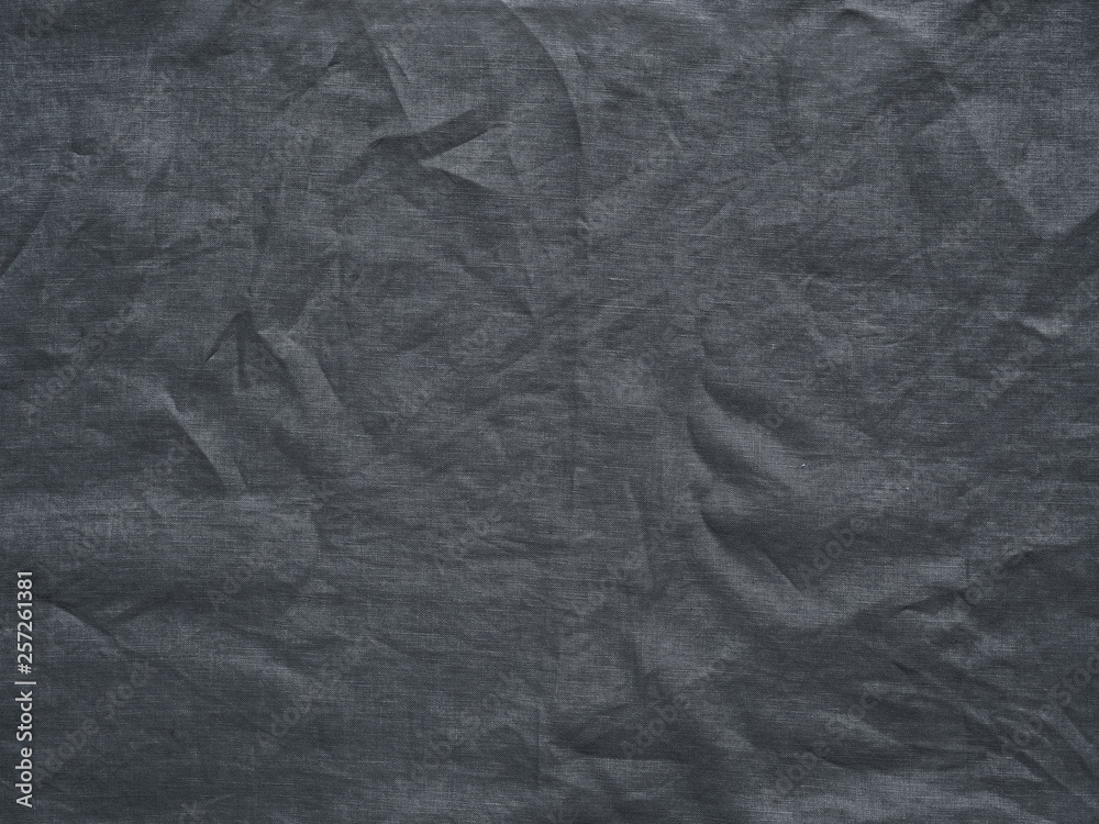 Gray linen texture as background. Gray linen crumpled tablecloth. Can use as mock up for design. Copy space for text Gray linen texture as background. Gray linen crumpled tablecloth. Can use as mock up for design. Copy space for text