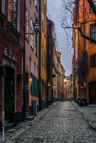 Old cobbled narrow street with colorful houses in Stockholm in the morning - 9