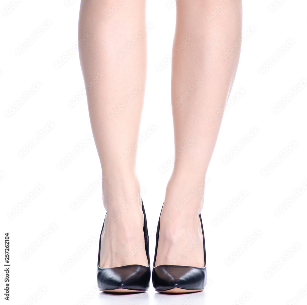 Female legs with black high heels shoes fashion on background isolation Female legs with black high heels shoes fashion on background isolation