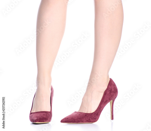 Female legs with red high heels shoes fashion on background isolation