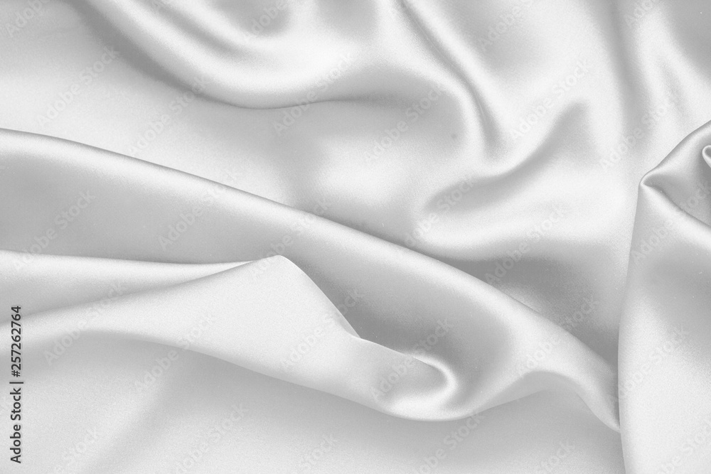 Obraz premium Rippled white silk fabric satin cloth waves background