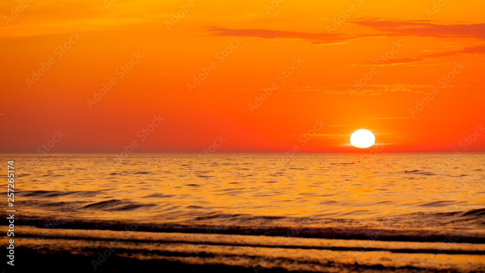 Idyllic shot of sunset by the sea Idyllic shot of sunset by the sea