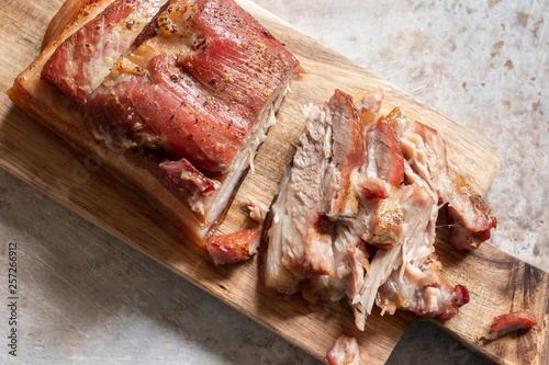 Baked carameled pork belly on a board photo