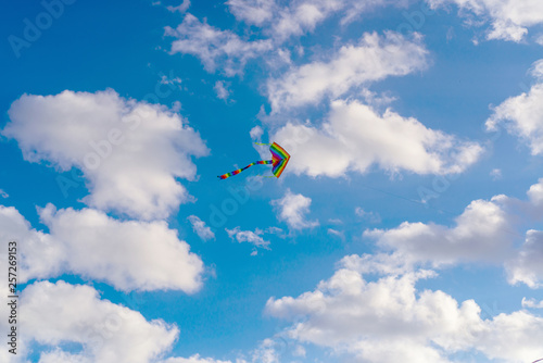 Kite flying in the sky among the clouds