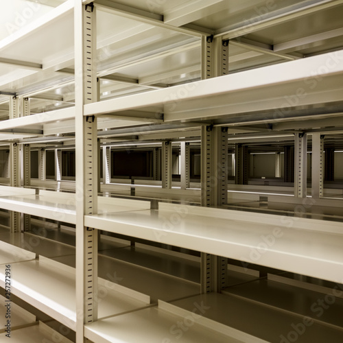 Empty metallic bookshelves