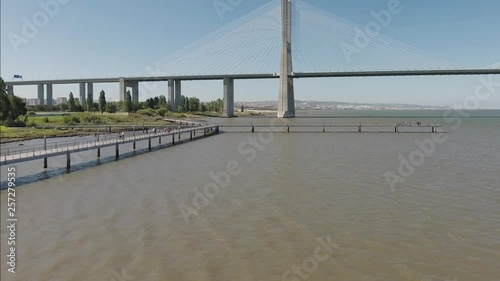 Vasco da Gama Cable stayed bridge river tagus in lisbon Portugal aerial shot 4k