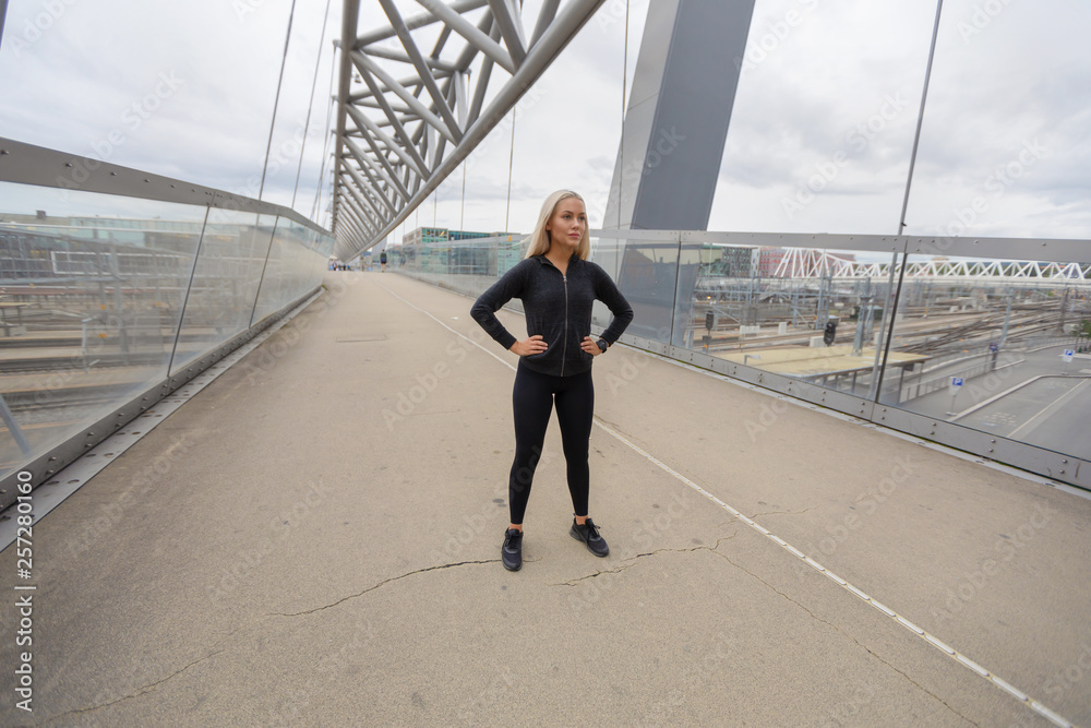 Beautiful Woman Athlete Standing At Modern Bridge In City Beautiful Woman Athlete Standing At Modern Bridge In City