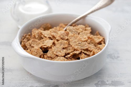 cereals in white bowl with milk