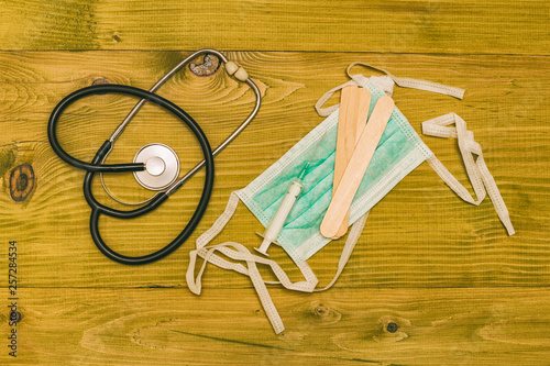 Image of medical equipment on wooden table.Toned photo.