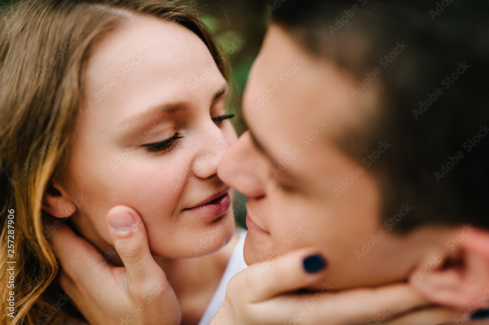 A woman kisses a man in a lips. Close up. A woman kisses a man in a lips. Close up.