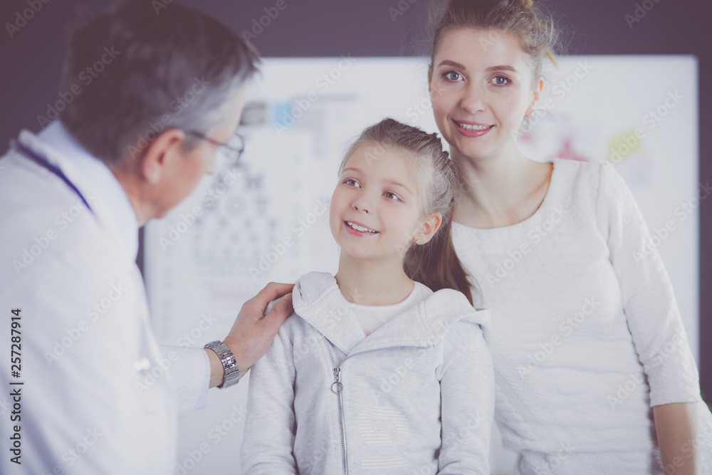 Little girl with her mother at a doctor on consultation Little girl with her mother at a doctor on consultation