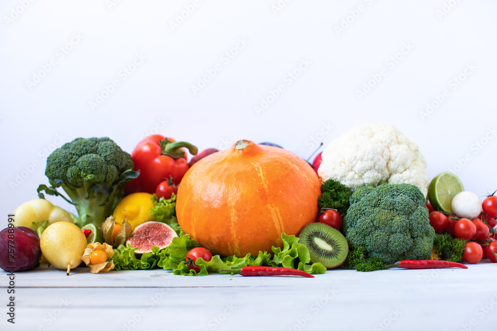 Heap of fresh fruits and vegetables on wooden background. Heap of fresh fruits and vegetables on wooden background.