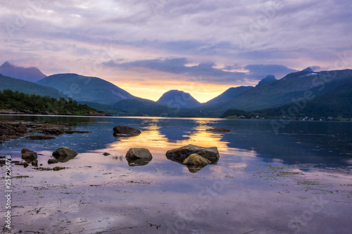 colorful sunset over the fjord on Senya island in Norway photo