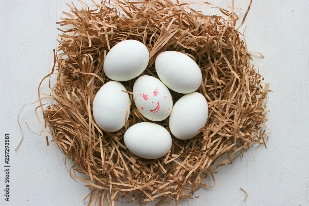 White eggs in a nest of straw. Easter. Copy space for text. White eggs in a nest of straw. Easter. Copy space for text.
