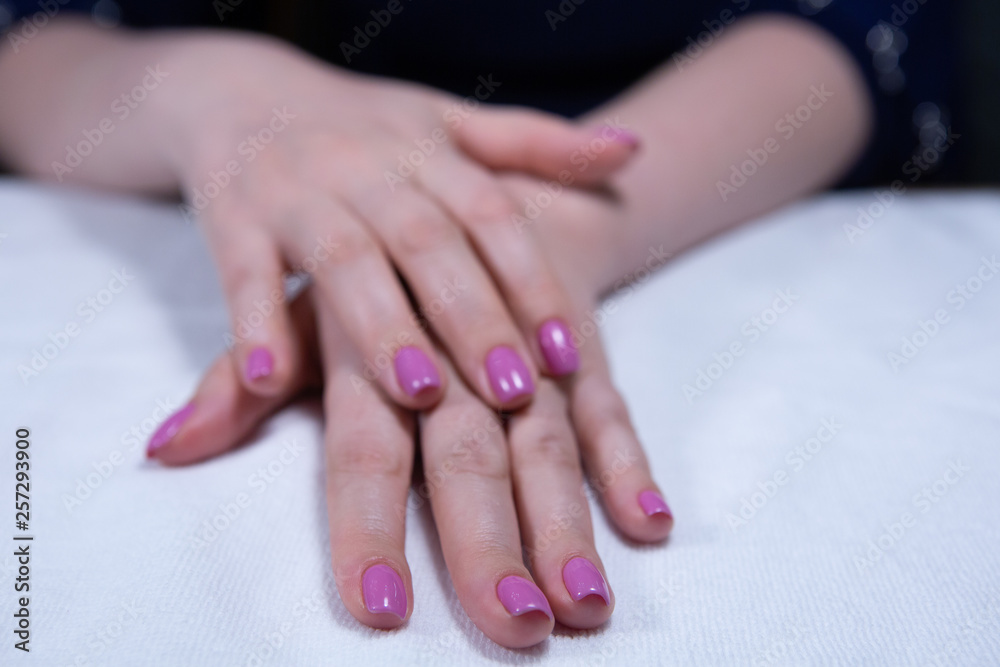Hands with beautiful nails painted bright, manicure