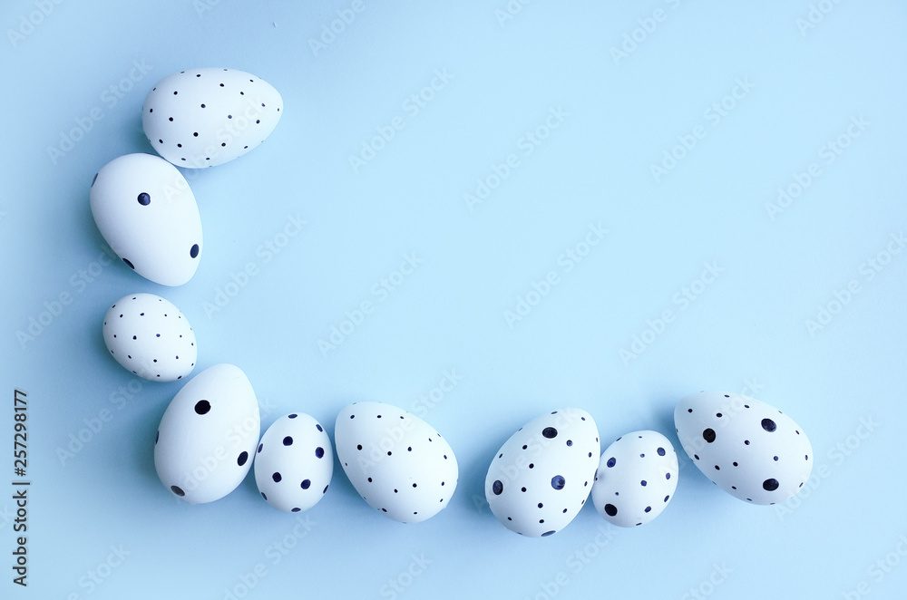 Ester eggs with copy space on blue background. Ester concept Ester eggs with copy space on blue background. Ester concept
