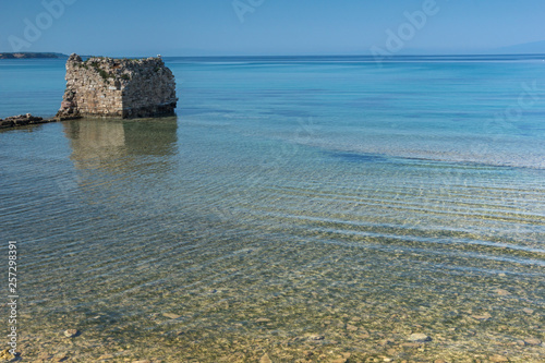 Ancient ruins at coastline of town of Nea Poteidaia, Kassandra, Chalkidiki, Central Macedonia, Greece photo