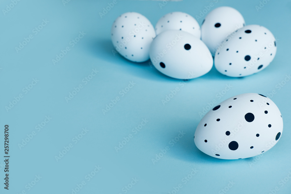 White Easter eggs and copy space for text. on blue background. Flat lay, top view. Easter concept White Easter eggs and copy space for text. on blue background. Flat lay, top view. Easter concept