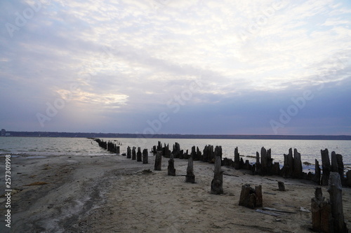 Kuyalnik estuary landscape. Kuyalnik liman salt lake in Odessa region of Ukraine. Wooden piles in a salt lake Kuyalnik estuary