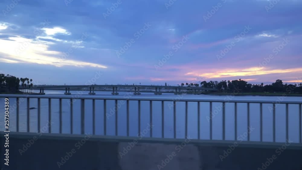 Car POV San Diego bay from the bridge at sunset in slow motion 60fps Car POV San Diego bay from the bridge at sunset in slow motion 60fps
