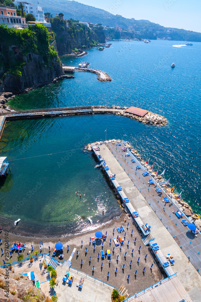 Fototapeta premium Seascape beautiful famous coastline. Aerial view of small beach. Sant'Agnello near Sorrento, Naples, Campania, Italy.
