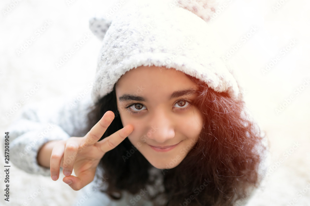girl child doing victory sign with her hand girl child doing victory sign with her hand