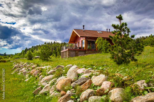 Wooden house in sunny weath...