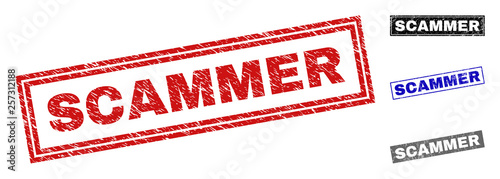 Grunge SCAMMER rectangle stamp seals isolated on a white background. Rectangular seals with distress texture in red, blue, black and gray colors.