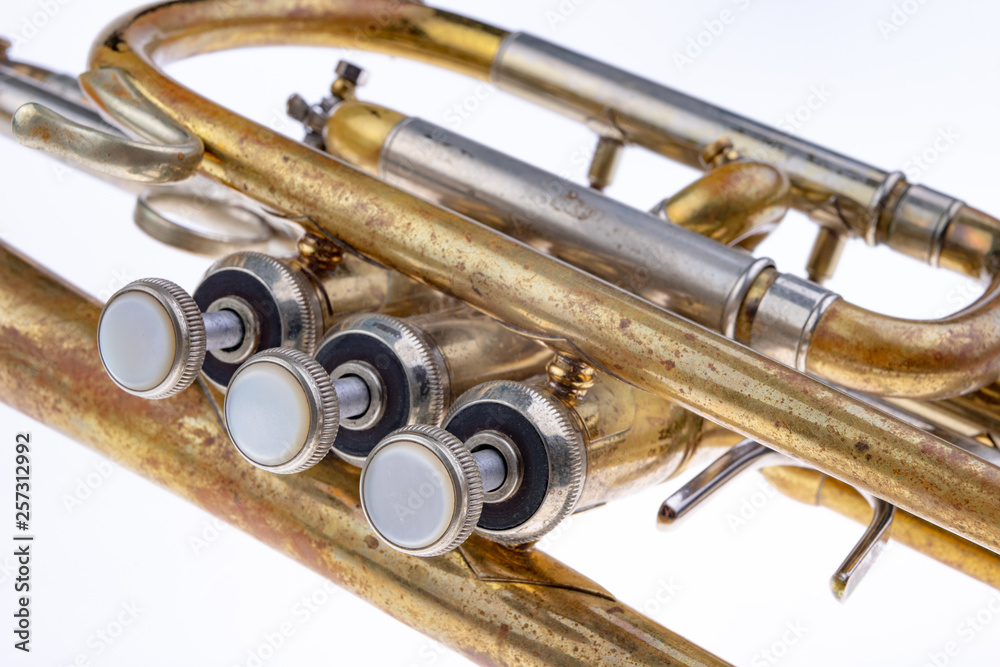 Naklejka premium An old trumpet covered with patina. Musical wind instrument.