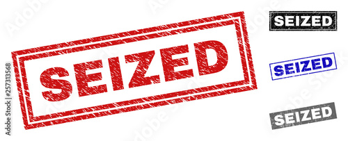Grunge SEIZED rectangle stamp seals isolated on a white background. Rectangular seals with grunge texture in red, blue, black and gray colors.