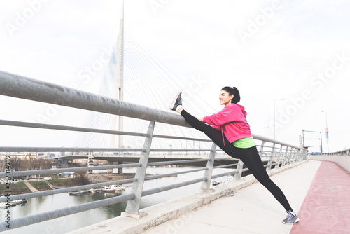 Sporty girl stretching