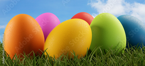 easter eggs green grass fie...