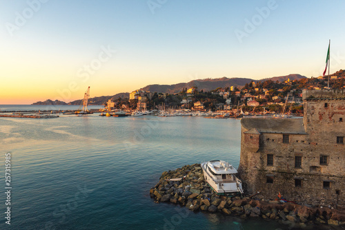 Broken yacht near ruins of old fortress in Rapallo town,Liguria, Italy © gorelovs