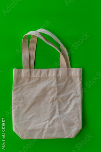 White cloth bag and green scene.