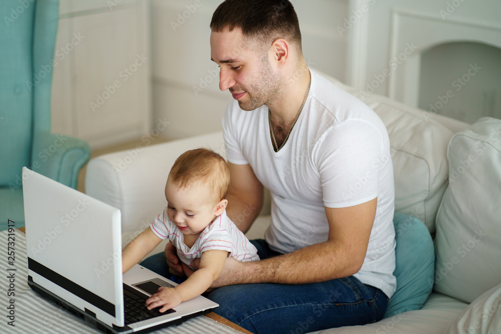 father and son watching video or playing game together. dad babysitting teaching baby boy to use laptop. Parenting, childhood, technology and people concept father and son watching video or playing game together. dad babysitting teaching baby boy to use laptop. Parenting, childhood, technology and people concept
