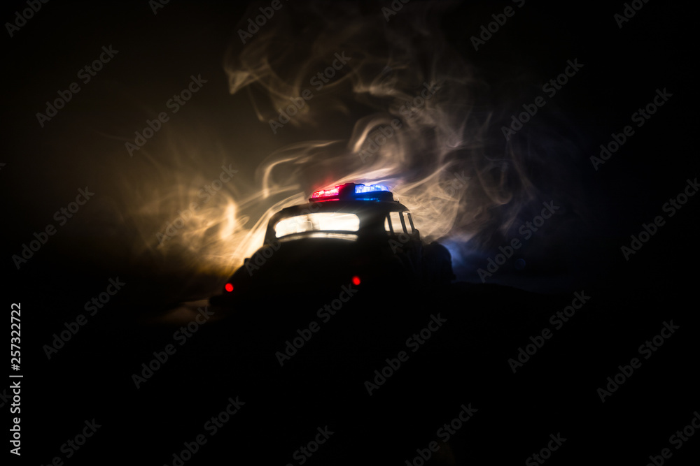 Police cars at night. Police car chasing a car at night with fog background. 911 Emergency response Police cars at night. Police car chasing a car at night with fog background. 911 Emergency response