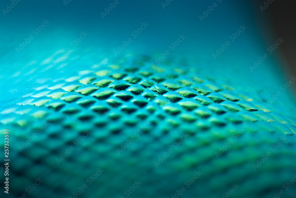 Blurred snake skin background. Bokeh. Holographic texture.